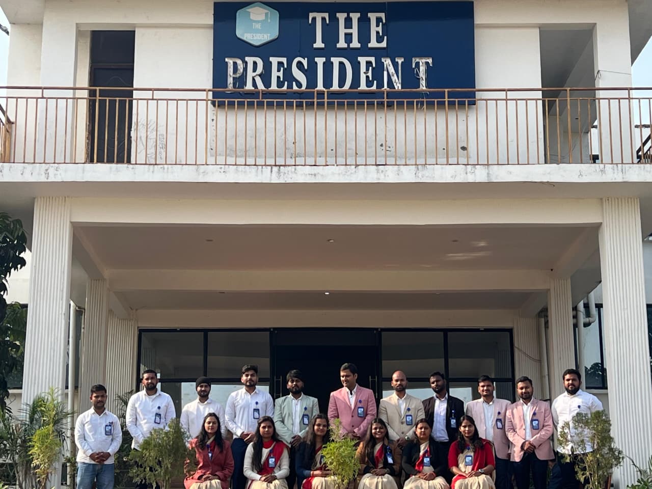 Diverse group of students smiling in a classroom